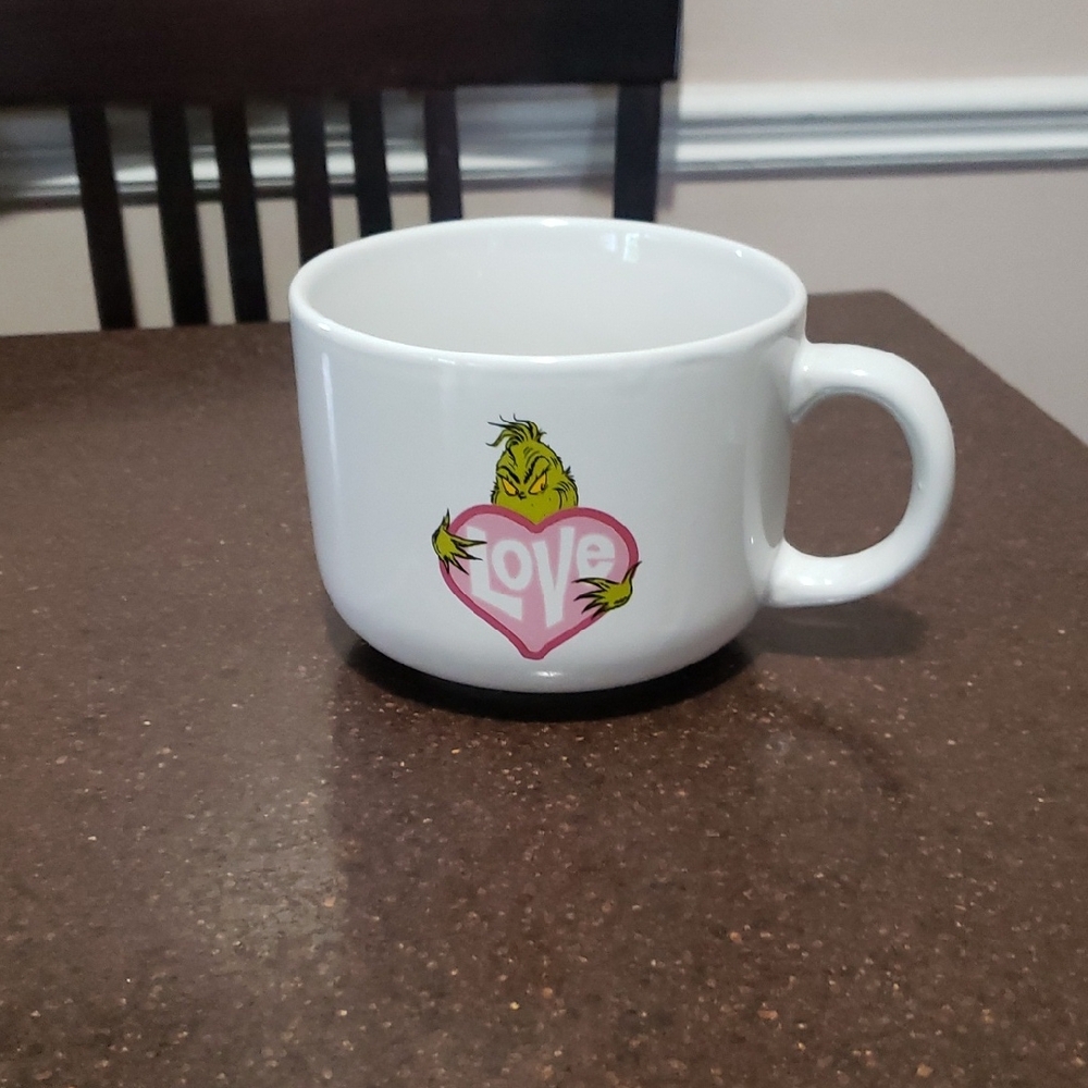 Grinch-themed extra large mug, featuring the character holding a heart.